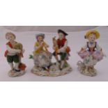 Three Sitzendorf figurines of children dancing and playing musical instruments, tallest 11cm (h)