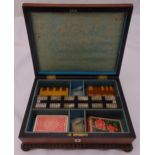 A mid 19th century rectangular wooden games box with Mother of Pearl inlay and gadrooned borders,