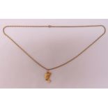 9ct gold pendant on a 9ct gold chain, approx total weight 9.4g