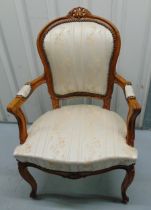 A mahogany upholstered armchair on four scroll legs, 42cm to top of seat