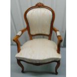 A mahogany upholstered armchair on four scroll legs, 42cm to top of seat