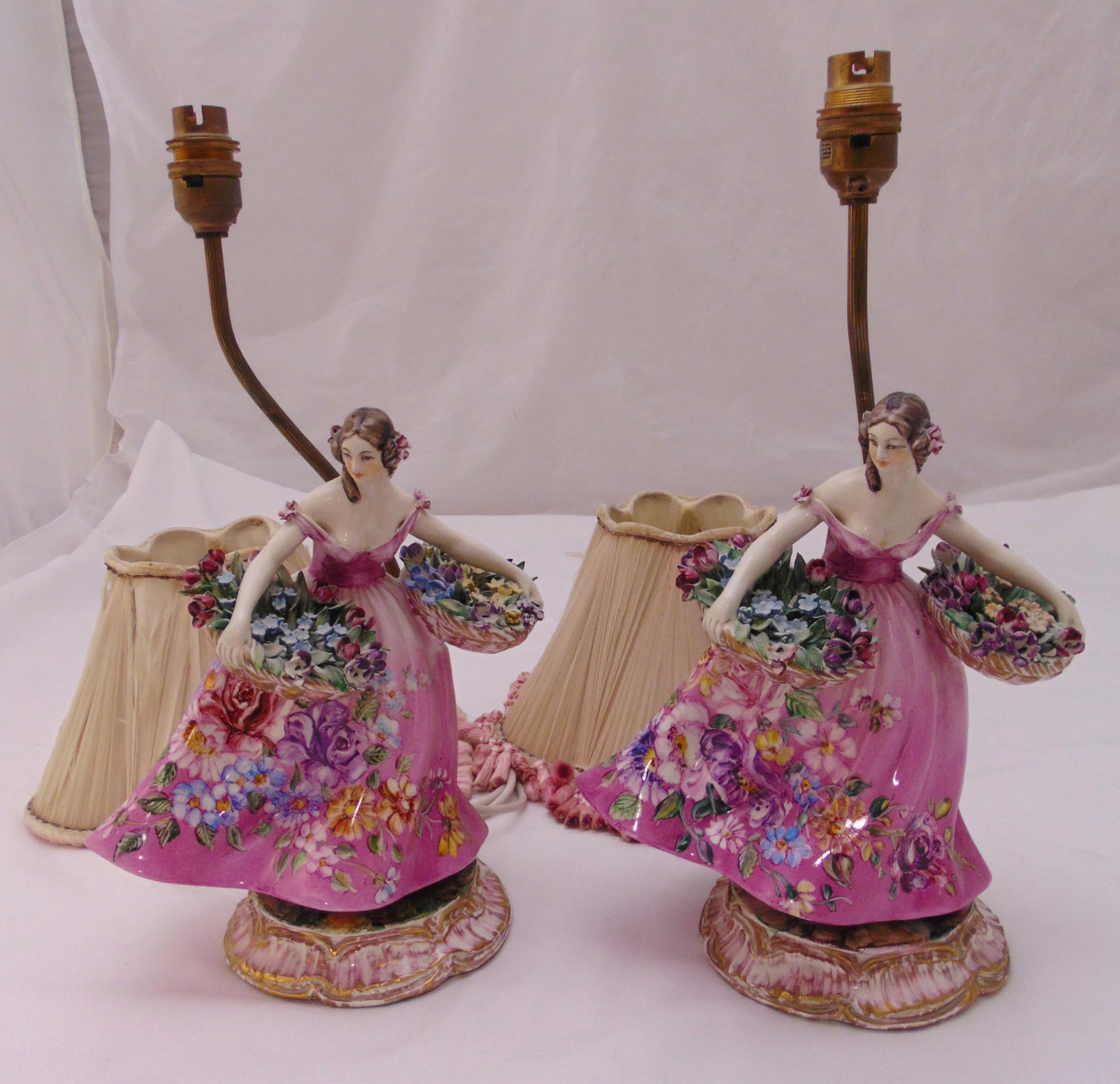 A pair of early 20th century ceramic figural table lamps to include shades, 40cm (h)