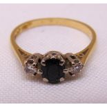 18ct yellow gold sapphire and diamond three stone ring, approx total weight 2.6g