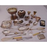 A quantity of silver plate to include basting spoons, goblets and cased napkin rings