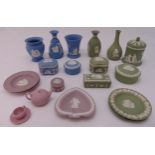A quantity of Wedgwood Jasperware of varying colour ways to include lilac, green and blue, vases,