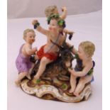 Meissen figural group of four putti and a goat on a naturalistic base, marks to the base, 16cm (h)
