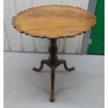 Late Victorian mahogany tilt top circular occasional table on three outswept legs, 73.5 x 67cm