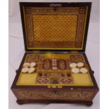 An early 19th century rectangular rosewood sewing box with brass inlay, the hinged cover revealing