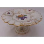 Meissen cake stand on raised circular base decorated with fruit and gilded scrolls, marks to the