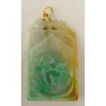 A carved rectangular jade pendant