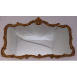 A gilded metal shaped rectangular wall mirror, 67 x 104cm