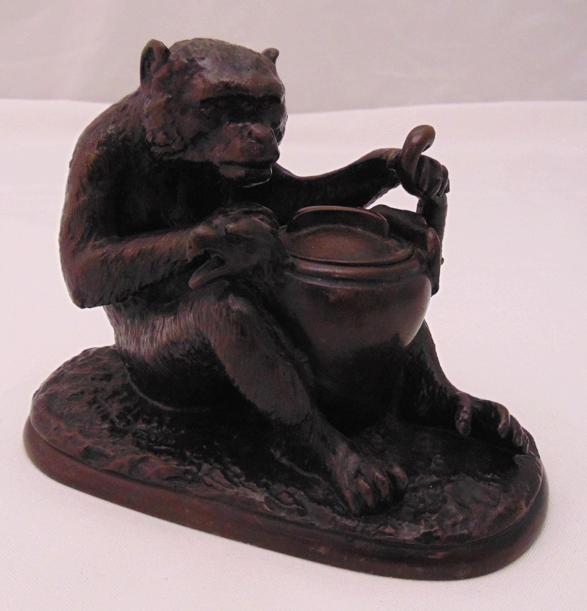 Fratin bronze figurine of a seated bear stuffing an eagle into a large covered pot, signed to the