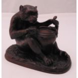 Fratin bronze figurine of a seated bear stuffing an eagle into a large covered pot, signed to the