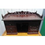 A 19th century oriental rectangular carved wooden desktop bureau with scroll and pierced gallery