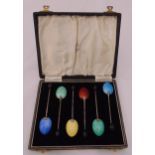 A cased set of hallmarked silver coffee spoons with enamel bowls and bean terminals, Birmingham