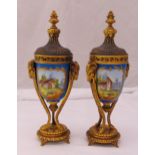 A pair of French Sevres style ormolu and ceramic vases and covers decorated with landscapes on