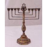 A hallmarked silver Menorah baluster form chased with flowers and leaves on raised hexagonal base,