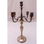 A continental white metal five light candelabrum stamped 800 with scroll arms on raised circular
