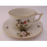 A Herend chocolate cup and saucer, decorated with birds on branches, marks to the bases, 10cm (h)