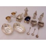 A quantity of hallmarked silver and white metal to include condiments, bonbon dishes and miniature