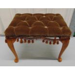 A mahogany rectangular upholstered stool on four scroll legs, 35 x 44 x 30.5cm