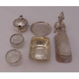 A quantity of hallmarked silver to include bonbon dishes, condiments, a coaster and salts (8)