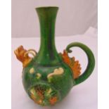 A Chinese Sancai pottery ewer with loop handle and lion mask spout, 25cm (h)