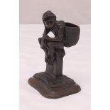 Fratin bronze figurine of a monkey carrying a basket and seated on a milestone, signed to the
