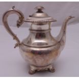 A George IV hallmarked silver coffee pot, baluster form, leaf capped spout and double scroll handle,