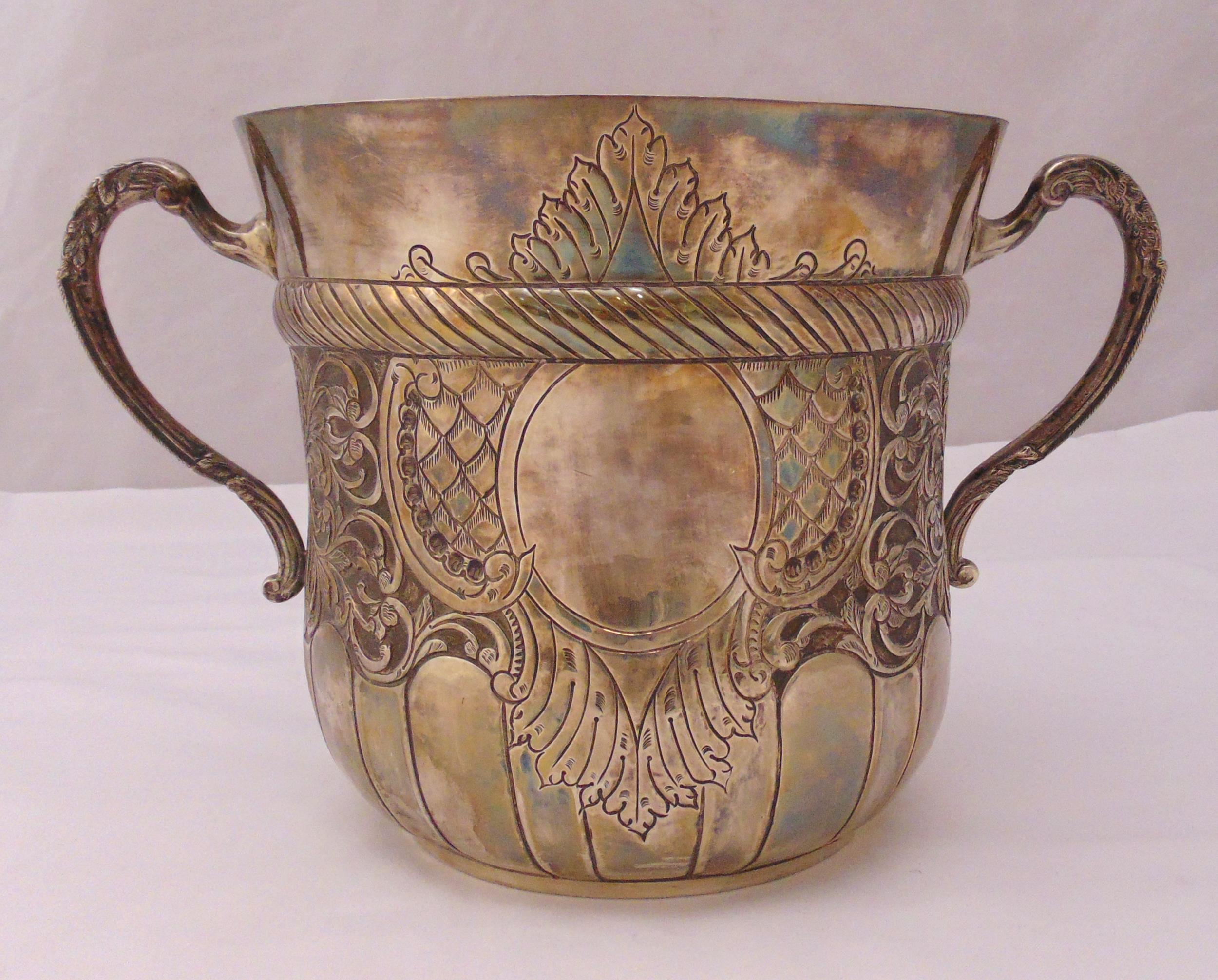 A continental white metal two handled champagne bucket in the form of giant porringer, stamped