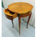 A French Kingswood and mahogany circular brass bound occasional table with single drawer on four