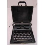An early 20th century Royal typewriter in fitted carrying case
