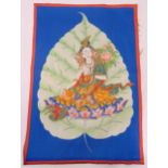 A Tibetan silk Tanka with an image of a Buddha on a lotus leaf, 58 x 39cm