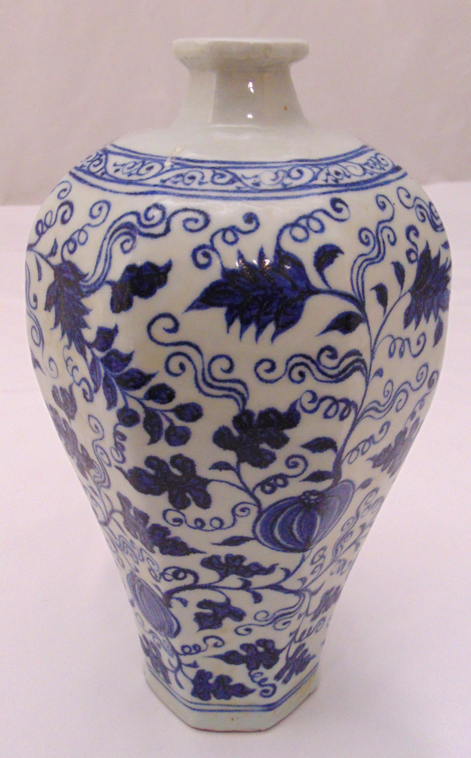 A Chinese Meipin blue and white octagonal vase decorated with flowers and leaves, 28cm (h)