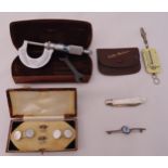 A quantity of collectables to include a cased set of Mother of Pearl button studs and cufflinks, a