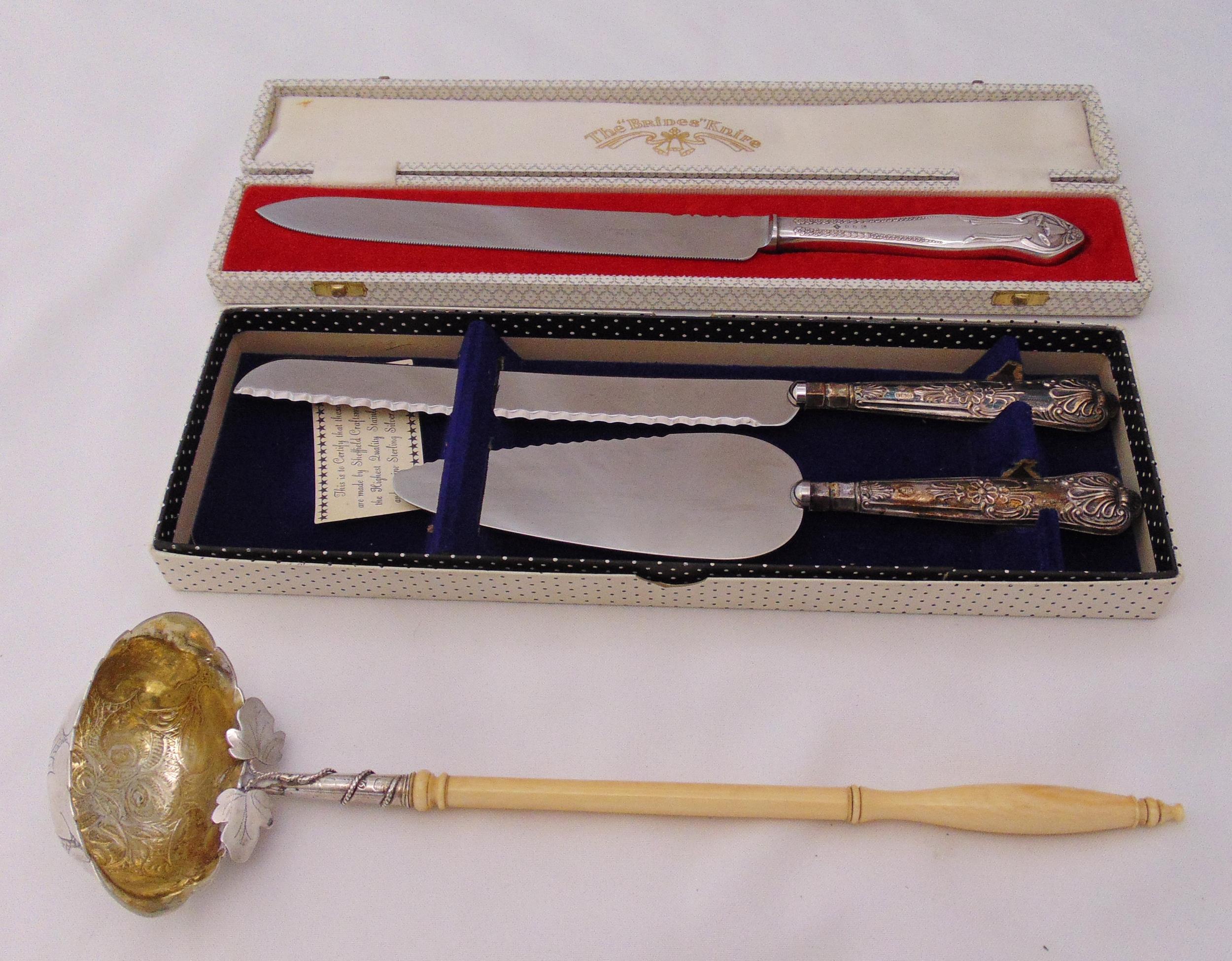A quantity of hallmarked silver and white metal to include a Brides knife in fitted case, a bread