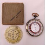 An antique Negretti and Zambra pocket weather meteorology forecaster barometer in original packaging
