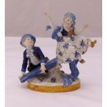 A Dresden figural group of a boy and girl on a seesaw, marks to the base, 16cm (h)