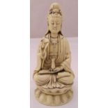A Chinese ceramic seated figurine of Guanyin on raised shaped base, 26cm (h)