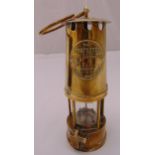 The Protector Lamp and Lighting Co. of Manchester brass mounted miners lamp, 24cm (h)
