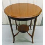 An Edwardian mahogany circular occasional table with inlaid satinwood banding on tapering outswept