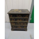 A Chinoiserie rectangular chest of drawers decorated with gilded oriental scenes with four drawers