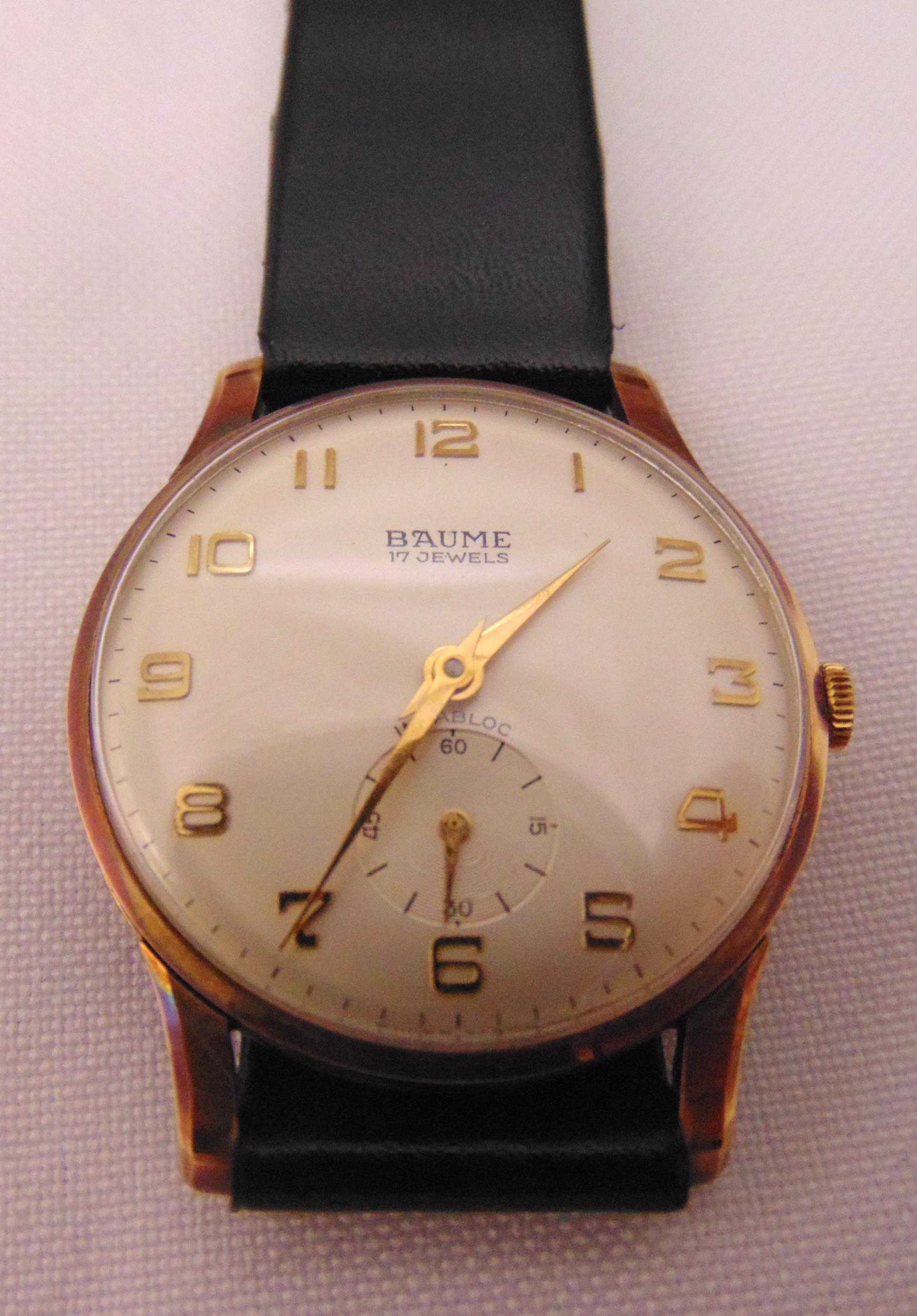 Baume 9ct gold gentlemans wristwatch on replacement leather strap in original packaging