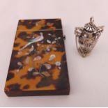 Tortoiseshell and Mother of Pearl card case and a white metal charm in the form of a ewer