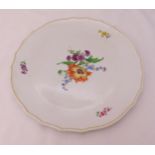 A Meissen cake plate decorated with flowers and leaves, marks to the base, 33.5cm (d)