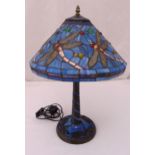 Tiffany style table lamp and shade decorated with dragon flies on raised circular base, 55cm (h)