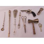 A quantity of vintage liquor cabinet accessories to include tongs, measures and bottle openers (10)