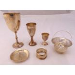 A quantity of hallmarked silver and white metal to include Kiddush cups, an egg cup, a coaster, a