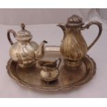 A white metal three piece teaset and matching tray