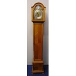 An oak cased grandmother clock with silvered dial with Roman numerals, two train movement, the